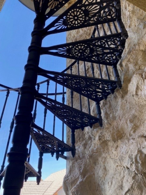 CAST IRON STAIRCASE SET IN THE STONE